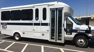 Mecklenburg Transportation System bus parked n a parking lot