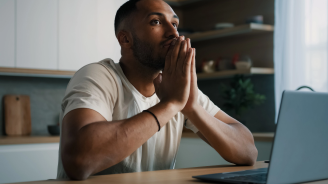 African Latina male man at kitchen at home play online game bet losing betting bad result feel frustrated upset working problems business failure with laptop cryptocurrency crash mistake with computer. High quality 4k footage