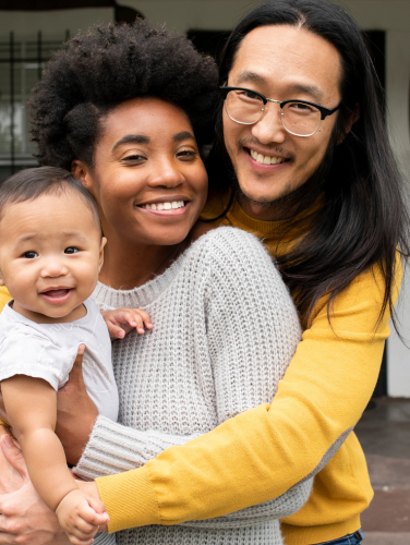 Multiethnic family standing at the porch during covid19 lockdown