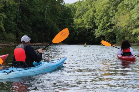 Park and Recreation visual guidelines cover of two individuals canoeing.