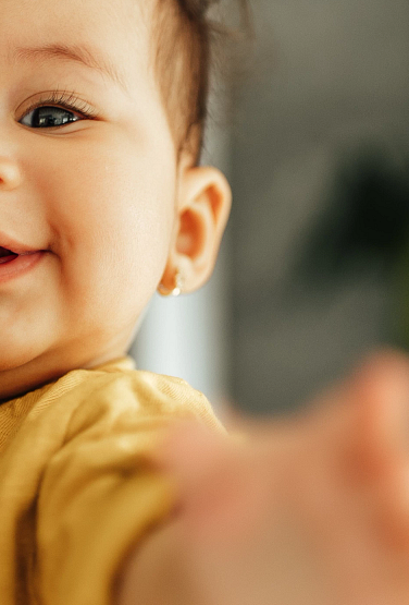Adorable baby and her dad, portrait.